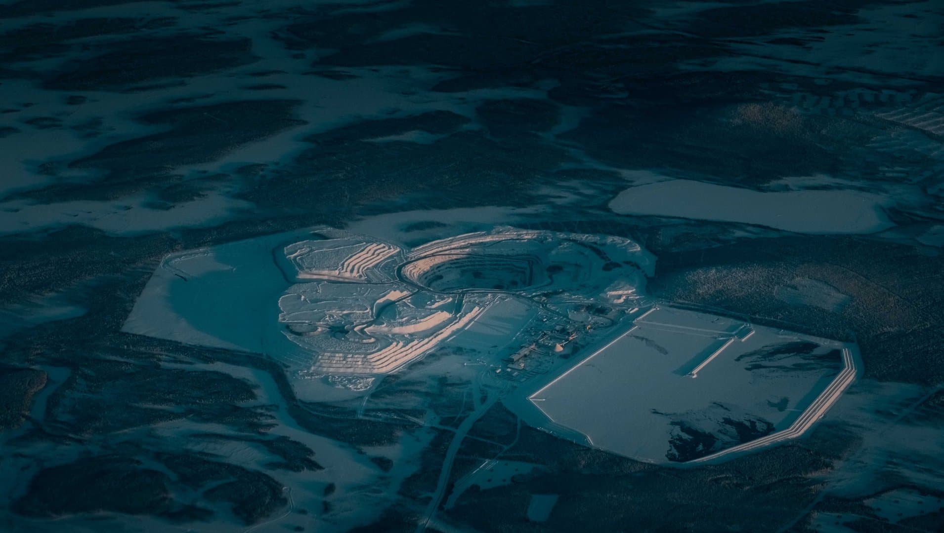 Aerial view of mining facility and tailings storage